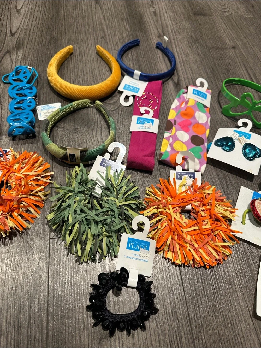 The Children's Place Orange Pom-Pom Hair Tie with Mixed Green and Black Accents